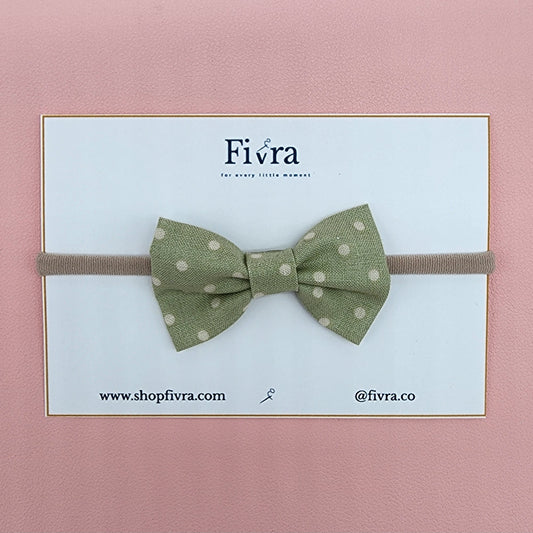 Small hair bow - Nylon headband - green dots